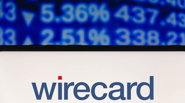 Logo Wirecard mit Börsenkursen im Hintergrund