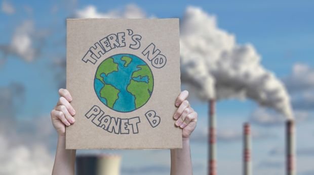 Schild eines Klima-Aktivisten (Symbol)