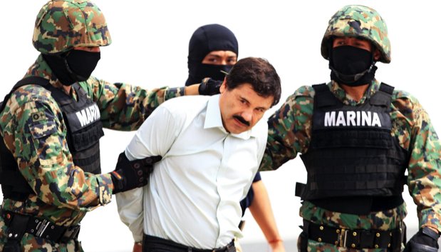 Mexican military hold Mexican drug lord Joaquin Guzman Loera, alias 'El Chapo' (C) at the Navy hangar in Mexico City, Mexico, 22 February 2014.