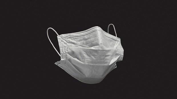 Ein Mundschutzmaske vor schwarzem Hintergrund