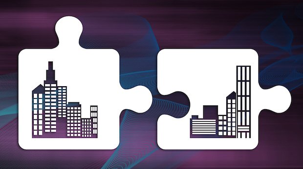 Symbolbild M&A: Zwei Puzzlestücke mit Bürokomplexen