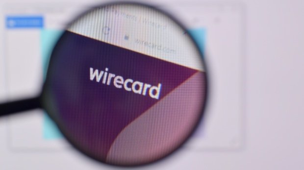 Die Homepage von Wirecard mit einer Lupe
