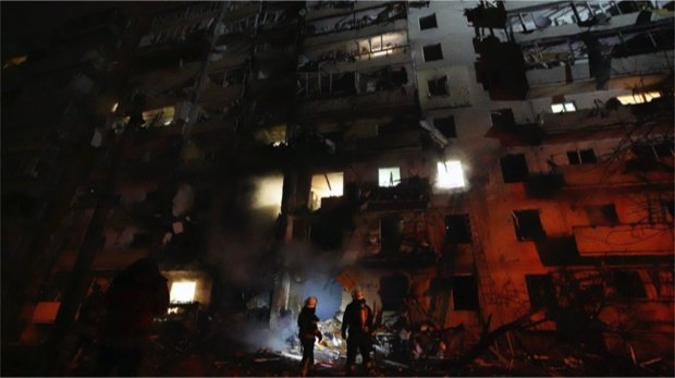 February 24, 2022, Kiev, Ukraine: Ukrainian firefighters respond to the a rocket attack on a residential building attacked by Russian military forces during the invasion near Kiev.